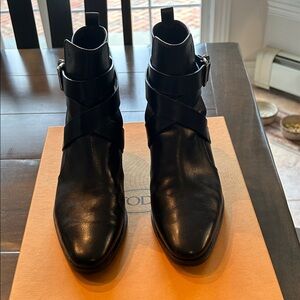 Tod's Black Ankle Boots with Strap Detail
In excellent condition, barely worn.
